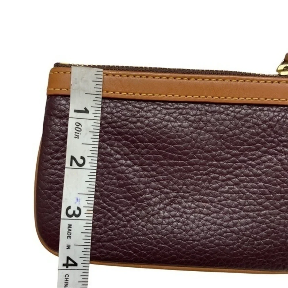 Dooney & Bourke purple and brown leather cosmetic bag